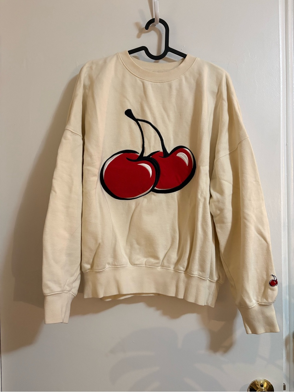 Cream Crewneck Sweatshirt with Red Cherry Graphic